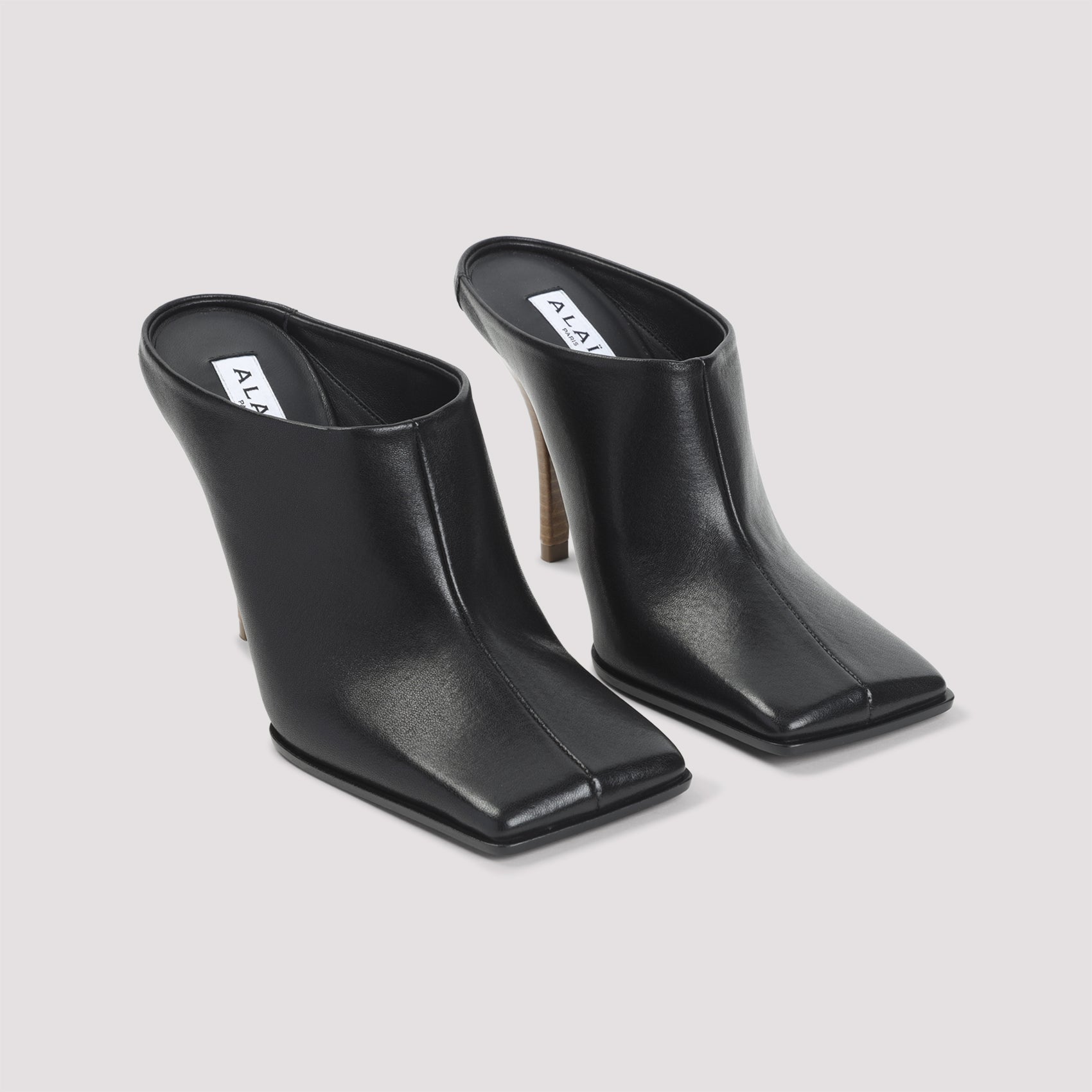 AlaÏA Mules - Black | 27190b604a678fe9e8ffc1644de7bc3064bd30d6
