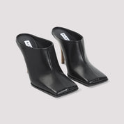 AlaÏA Mules - Black | 27190b604a678fe9e8ffc1644de7bc3064bd30d6
